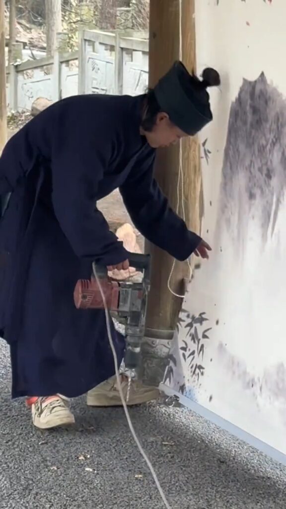 but in reality, Taoist nun's one handed electric drill