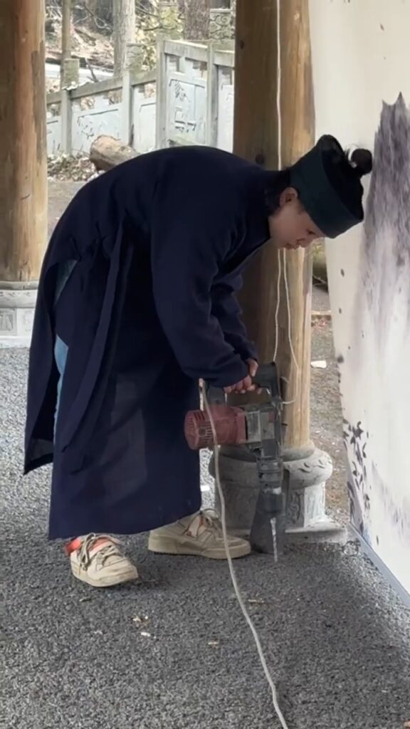 but in reality, Taoist nun's one handed electric drill